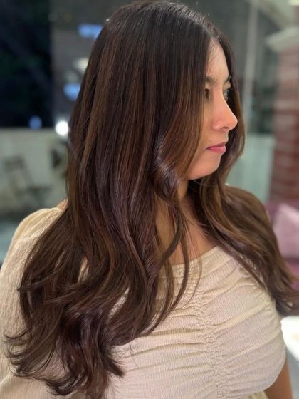 A beautiful side profile showing off the soft layers and subtle balayage.