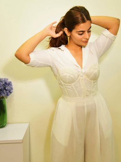 Getting ready and pulling my hair back. This angle shows how the corset defines the waist, creating a beautiful hourglass shape even with a layered look.