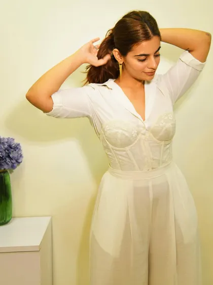 Getting ready and pulling my hair back. This angle shows how the corset defines the waist, creating a beautiful hourglass shape even with a layered look.