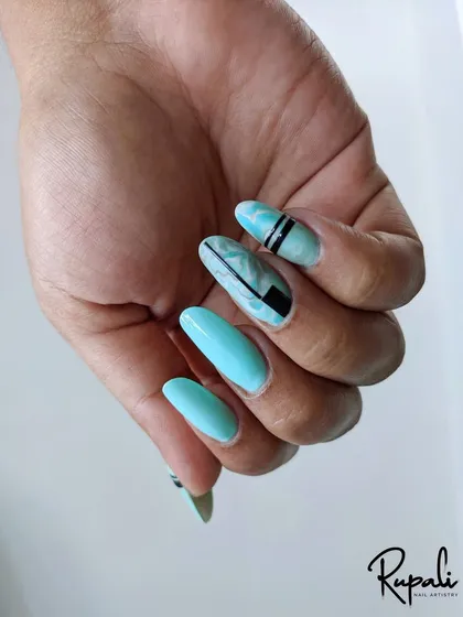 A beautiful example of marble nail art on a client's hand.