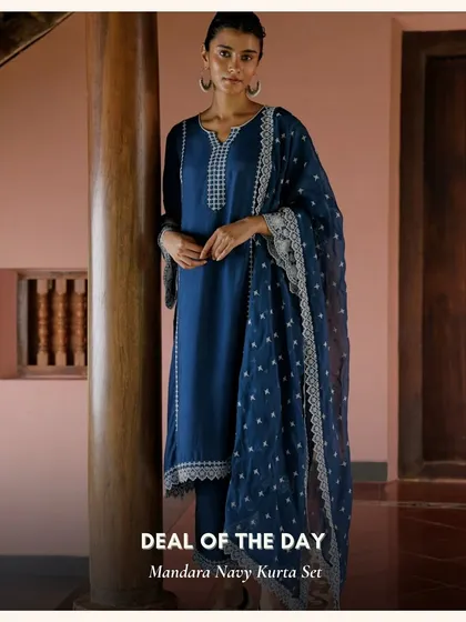 The Mandara Navy Kurta Set is a sophisticated and timeless piece. The deep navy blue is complemented by delicate white embroidery for a classic look.