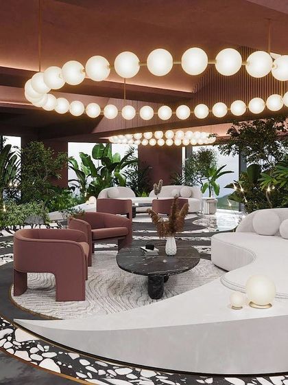 The lounge is a concoction of sophistication and drama, with berry-colored walls, plush white sofas, and stunning views.