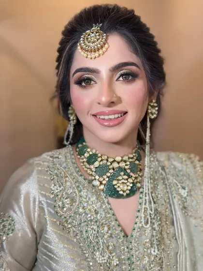 A beautiful party makeup look. We created a shimmery golden-green eye and paired it with an elegant updo for a sophisticated style.