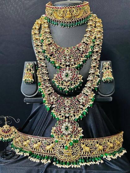 The complete green and kemp stone bridal set, featuring three necklaces for a rich, layered look. This is perfect for the bride who wants to make a grand statement.