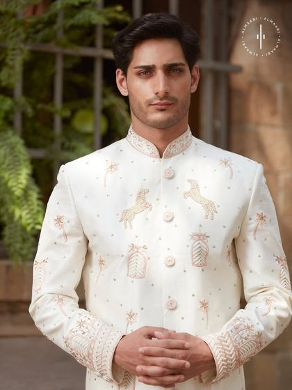 The craftsmanship on this piece is everything. This close-up shows the delicate embroidery and button details on one of my signature groom sherwanis. It’s about looking sharp from every angle.