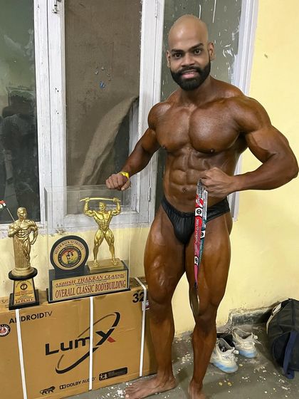 Posing with my trophy after winning the overall in classic physique. This is the goal we set and the goal we achieve.