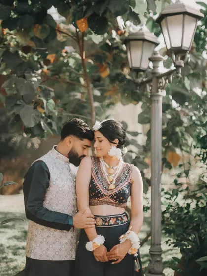 A quiet, romantic moment between Rahul and Anjali in a garden setting. The soft, natural light is perfect for capturing tender interactions.