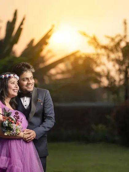 An expecting couple is captured against a beautiful sunset backdrop during their outdoor maternity shoot. I create romantic and scenic pregnancy portraits in locations around Kolhapur.