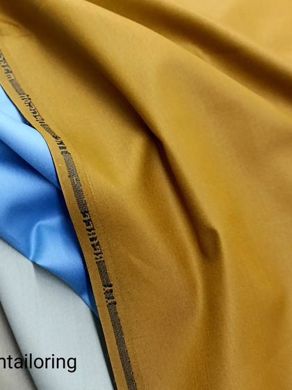 This image shows a selection of my high-quality Terrycot fabrics, perfect for saya kurtas. The mustard, blue, and off-white colors have an elegant weave and a great feel.