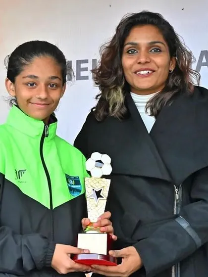 A close-up of Tanya with her Top Scorer trophy. This award recognizes her incredible ability to find the back of the net.
