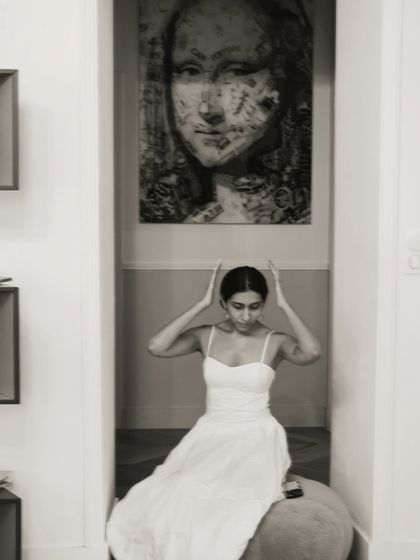 A playful moment under a piece of art in my studio. My personal style is a lot like my professional style, a mix of classic, comfortable, and a little bit dreamy.