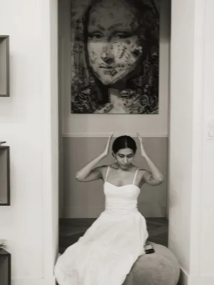 A playful moment under a piece of art in my studio. My personal style is a lot like my professional style, a mix of classic, comfortable, and a little bit dreamy.