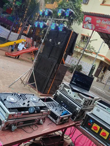 This is a look at my professional DJ gear ready for an outdoor Haldi event. I use reliable equipment, including a Pioneer DJ controller, mixer, and powerful speakers, to deliver crisp, clear sound that you can count on.