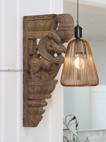 This image demonstrates a creative use for our brackets. Here, a Yaali bracket is used as a decorative wall mount next to a modern pendant light, showing how traditional craft can blend with contemporary design.