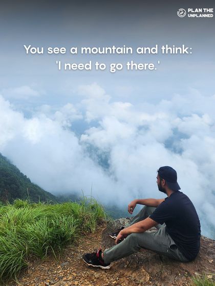 A lone trekker looking out at a mountain range. This captures the feeling of seeing a mountain and thinking, "I need to go there."