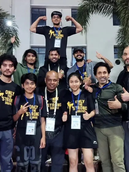 The full team, including our youngest members, celebrating our success. We build champions at every age.