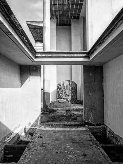 Another in-progress shot of the entrance, this view from the ground level looks up through the structure. It shows the bare concrete walls and the open space where the water features and grand columns will eventually stand.