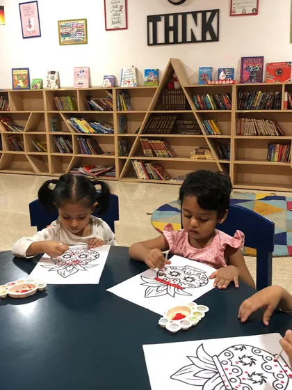 Two friends completely absorbed in painting Ravana masks for Dussehra. It’s wonderful to see them concentrating so hard, using brushes to carefully fill in the colors.