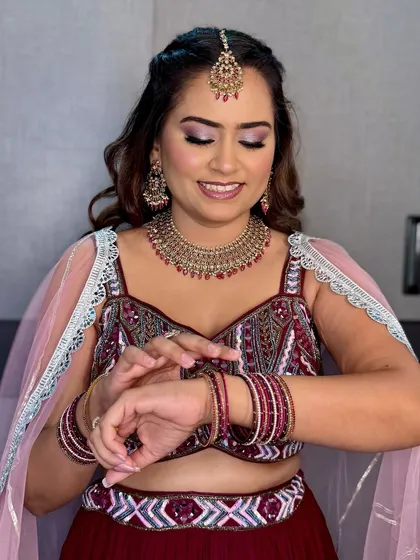 A candid moment of the bride. Her makeup is perfectly set to look flawless throughout her engagement party.