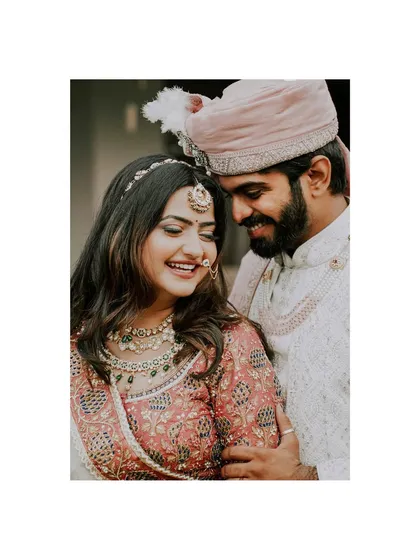 A close-up of pure happiness. The groom embraces his bride, their smiles reflecting the culmination of a seven-year journey from a chance meeting to this perfect wedding day.