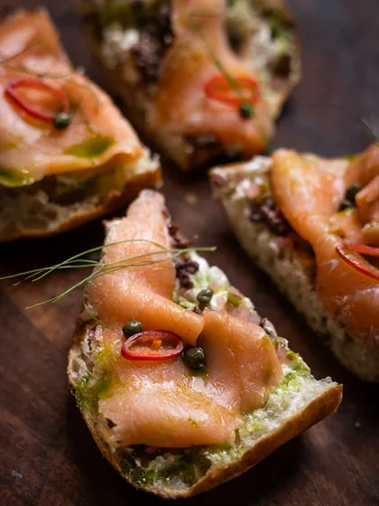 For a taste of elegance, try my Smoked Salmon Bruschetta. Delicate smoked salmon on a crispy base, it's the perfect bite to start your meal.