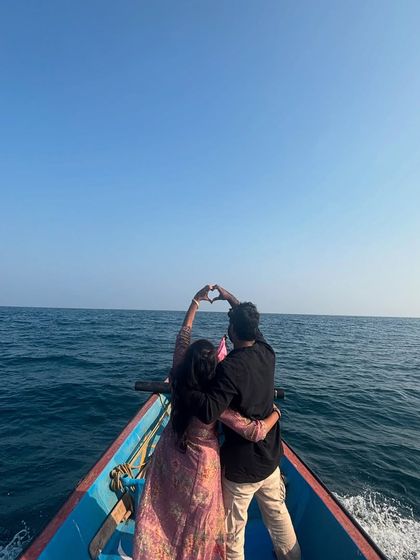 A classic heart pose against the vast ocean, symbolizing a love as deep and wide as the sea.
