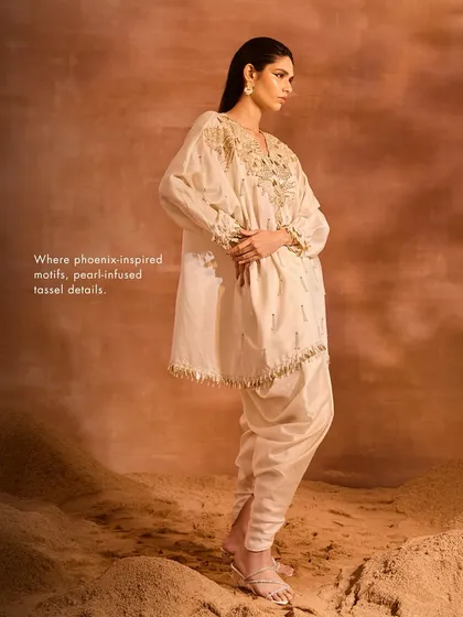 The Orion Kaftan Set, where phoenix-inspired motifs and pearl-infused tassel details intertwine to make an exquisite, modern ethnic ensemble.