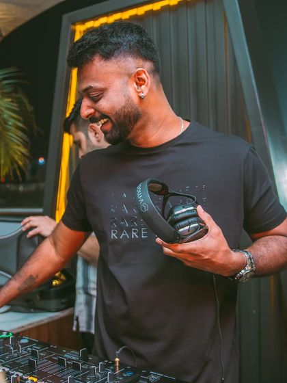 A candid moment of laughter and joy behind the decks. This is what it's all about.