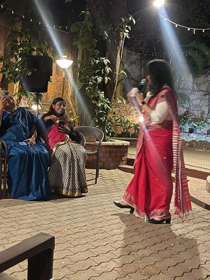 A candid shot while speaking at an evening event. My attire, an Assamese handwoven saree, was chosen to be appropriate for the occasion while reflecting my personal style.