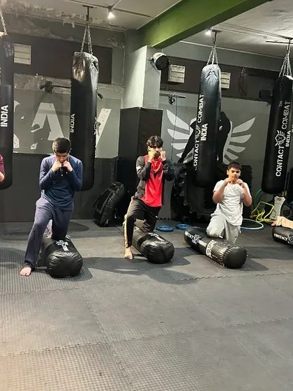 After a tough session, there's a sense of accomplishment. Here, students pose after drills, showing the focus and discipline that our training instills.