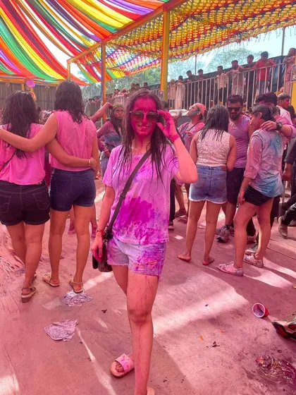 A wider shot of the Holi festival, showing the crowd and the colorful setup. I thrive in these high energy environments, both as a participant and an organizer.