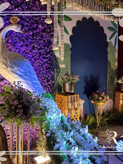 We believe beauty is in the details. This handcrafted peacock, adorned with a cascade of purple and white flowers, is a perfect example of how we weave symbolic and artistic elements into our South Indian wedding decor.