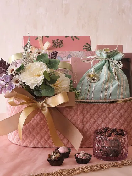 The Twinkling Star Hamper is one of our most comprehensive offerings. It includes everything from sugar-free mithai and chocolate assortments to tea cakes and brownies, all packed in a beautiful quilted pink basket.