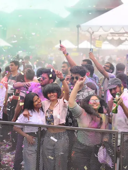 Happy faces in the crowd at the Sunburn Holi party. My goal is simple: to make people dance, smile, and have the time of their lives.
