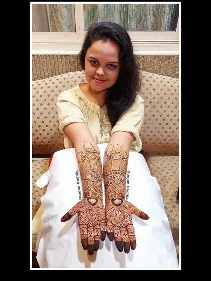 My happy client Rasika, showing off her intricate engagement mehendi. The design is a beautiful mix of traditional patterns and modern elements.