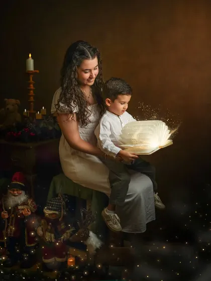 My storybook sessions are where we bring a little fantasy to life. With a few carefully chosen props, like this glowing book, we can create a world of wonder for your children to explore together, capturing the magic of their shared imagination.