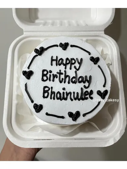 A birthday cake for a sibling, with 'Happy Birthday Bhainulee' (little sister) written in a heart-themed border.