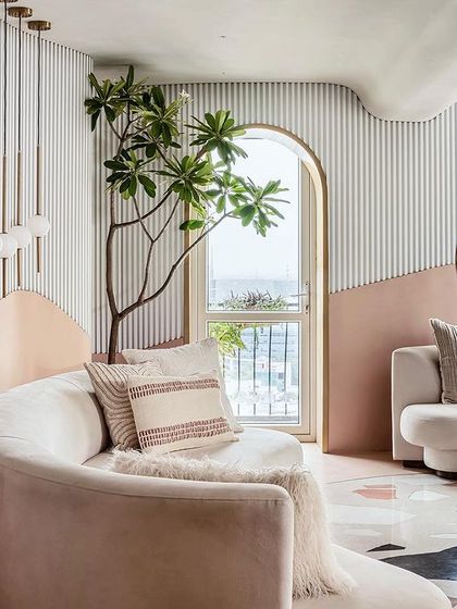 Another view of the living room, showing how the space flows seamlessly towards the outdoor terrace.