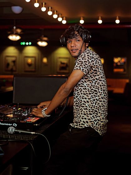 A quick look at the camera while keeping the party going.