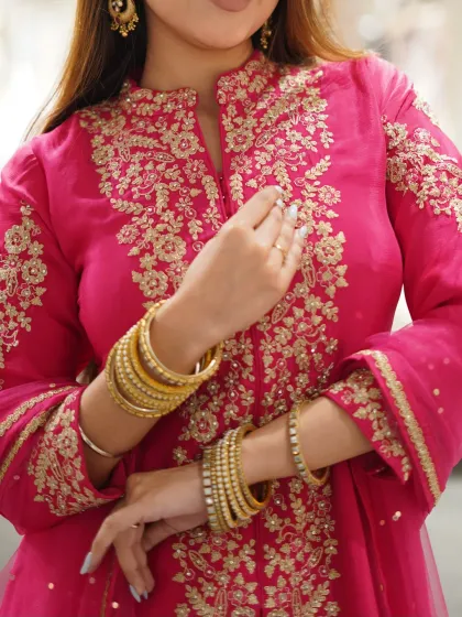 A perfect blend of tradition and trend, shine effortlessly in this pink embroidered suit.