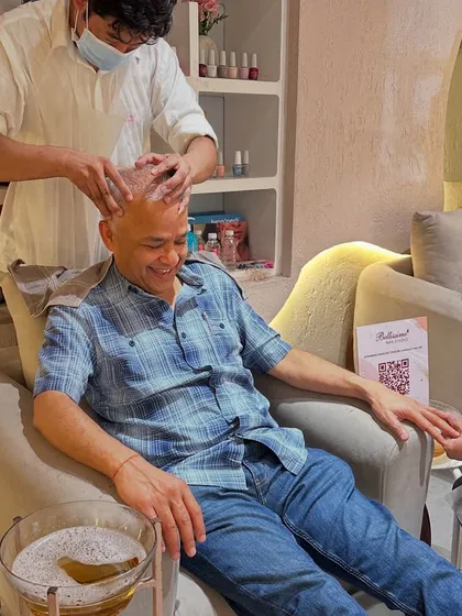 This is the full Bellissimo experience in one chair. A client enjoying a relaxing head massage while getting a meticulous manicure and a refreshing pedicure. We believe self care is a necessity, not a luxury.
