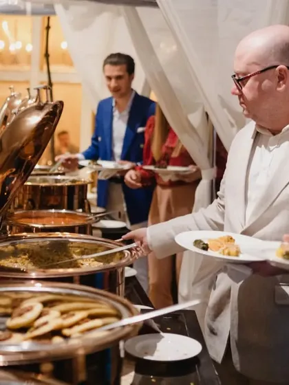 A guest enjoying the buffet during a special event. We can provide various service styles, including buffet setups for larger gatherings.