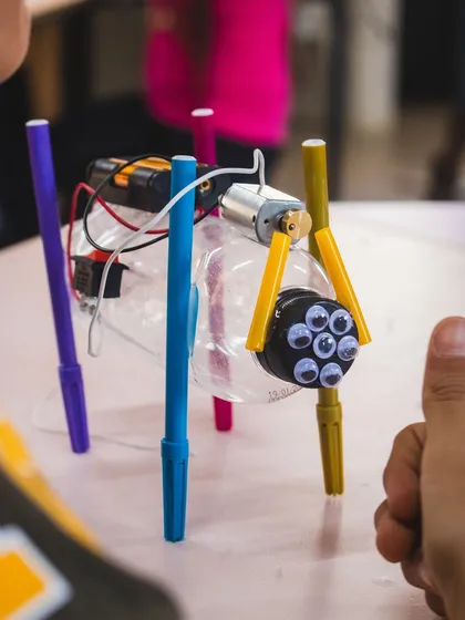 A close-up of a completed Art Bot, complete with googly eyes for personality. This shows how kids can customize their creations.