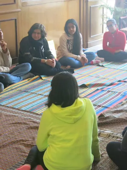 This is what my process looks like on the ground. A circle of trust, where we connect as humans first. In this intimate setting, we sit together, listen, and share, creating a space where honest stories and self-discovery can flourish without pressure or judgment.