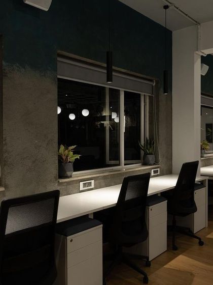 Here, I used focused pendant lights to provide dedicated task lighting over individual workstations. This approach ensures each person has clear, direct light for their work, minimizing eye strain, especially during late hours.