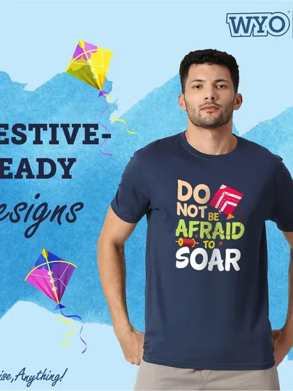 "Do not be afraid to soar." An inspirational t-shirt design for the kite flying festival, combining a festive theme with a motivational message.