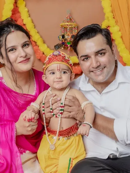 The whole family joins in to celebrate with their little Krishna. A wonderful way to create a unique family portrait.