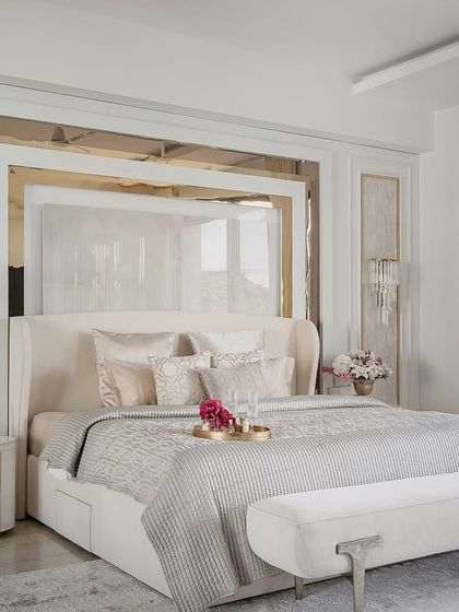 A beautifully appointed bedroom showcasing our signature style of quiet luxury. This space combines layered textures, a soothing color palette, and bespoke furniture to create a personal sanctuary for rest and relaxation.