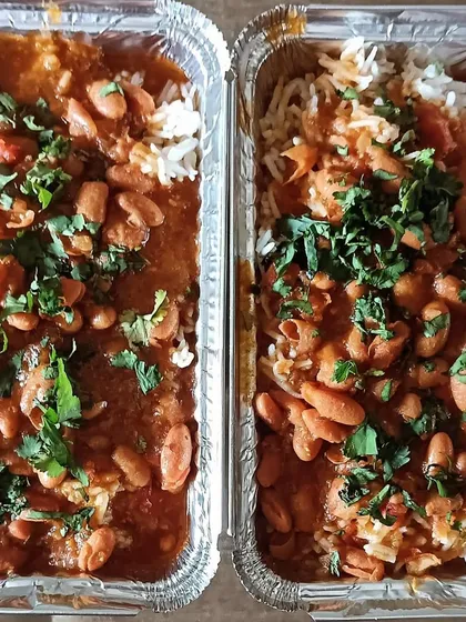 A pair of Rajma Chawal combos, garnished generously with fresh coriander. It's a simple pleasure that I love sharing with my customers.