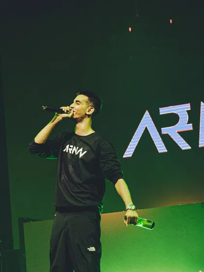 It's not just about the music; it's about performance. Here I am on the mic, hyping up the crowd and ensuring everyone is part of the show, a key element of my stage presence.